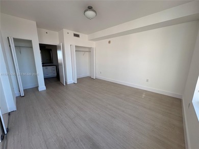 Bright corner unit at The Ivy Condominium featuring