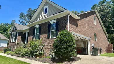 This 4-bedroom, 3-bath brick home is located in Miller Pond in - photo 3