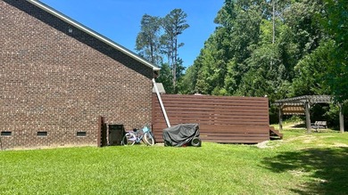 This 4-bedroom, 3-bath brick home is located in Miller Pond in - photo 7