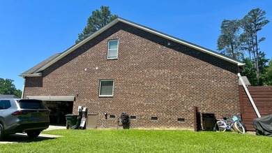 This 4-bedroom, 3-bath brick home is located in Miller Pond in - photo 8