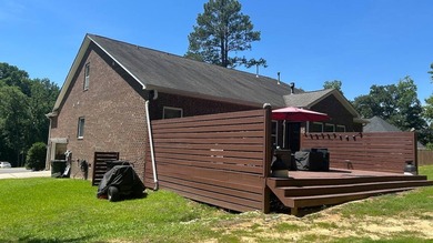 This 4-bedroom, 3-bath brick home is located in Miller Pond in - photo 9