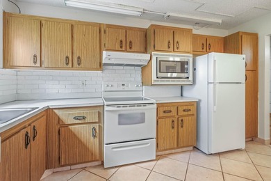 WELCOME TO THIS CONVENIENT GOLF FRONT CONDO! LIFE IS A BIT - photo 4