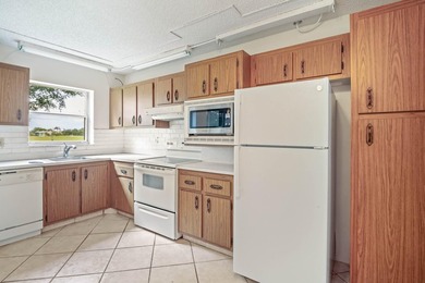 WELCOME TO THIS CONVENIENT GOLF FRONT CONDO! LIFE IS A BIT - photo 6
