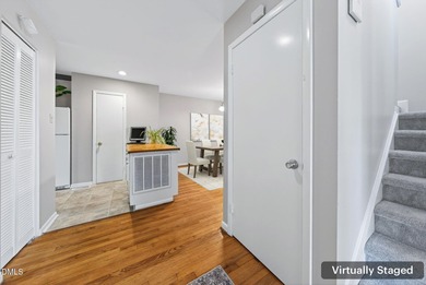 Beautifully updated end-unit townhome offering 3 bedrms & 3 full