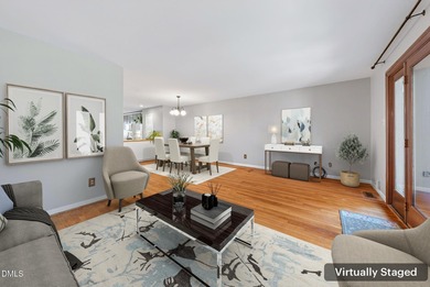 Beautifully updated end-unit townhome offering 3 bedrms & 3 full