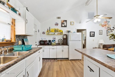 This beautiful cottage offers versatile living with a covered - photo 6