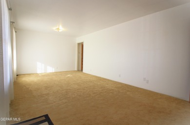 This charming single-level brick home in the highly desirable