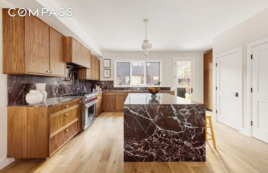 A rare Red Hook townhouse offering two separate residences on - photo 3