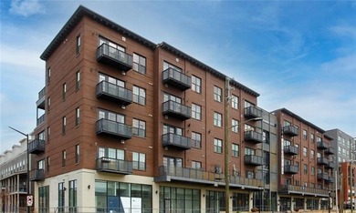 Bright, open double corner unit located just one block from the