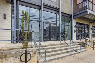 Bright, open double corner unit located just one block from the