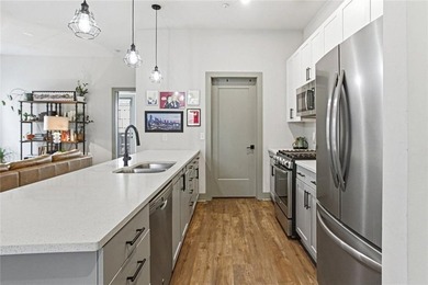 Bright, open double corner unit located just one block from the