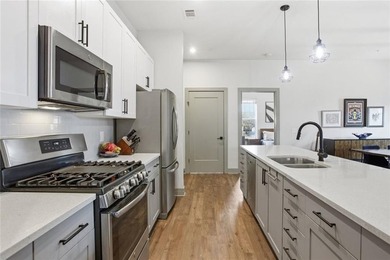 Bright, open double corner unit located just one block from the