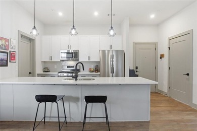 Bright, open double corner unit located just one block from the