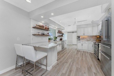 Experience refined waterfront living in this extensively - photo 6
