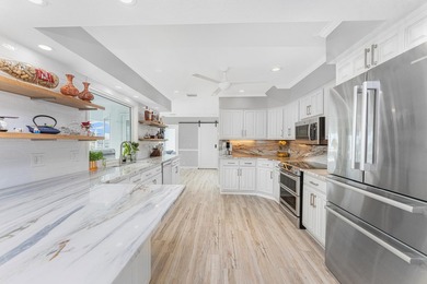 Experience refined waterfront living in this extensively - photo 7