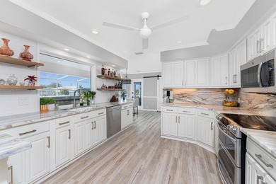 Experience refined waterfront living in this extensively - photo 9