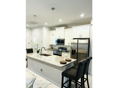 Custom-built in 2022, this beautifully designed 3-bedroom - photo 11