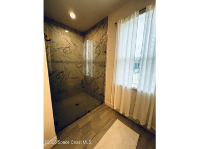 Custom-built in 2022, this beautifully designed 3-bedroom - photo 21