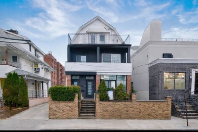 Beautiful fully renovated, detached 3-family home offering - photo 1