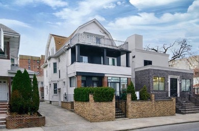 Beautiful fully renovated, detached 3-family home offering - photo 2
