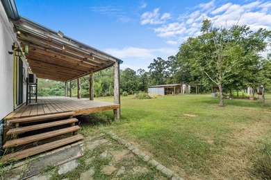 Tucked away among nearly 39 acres of towering timber, this East - photo 26