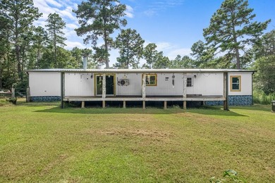 Tucked away among nearly 39 acres of towering timber, this East - photo 29