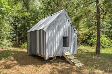 Tucked away among nearly 39 acres of towering timber, this East - photo 34