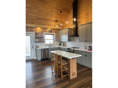 Beautiful cabin style lake front home with year round water! - photo 12