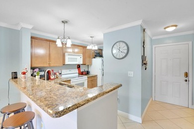 Welcome to this inviting first-floor condo in a gated community - photo 2