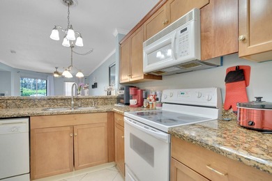 Welcome to this inviting first-floor condo in a gated community - photo 4