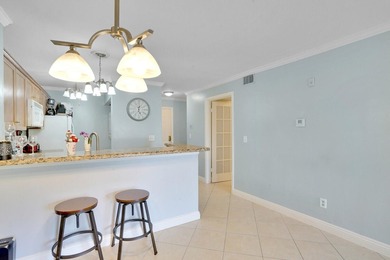 Welcome to this inviting first-floor condo in a gated community - photo 10