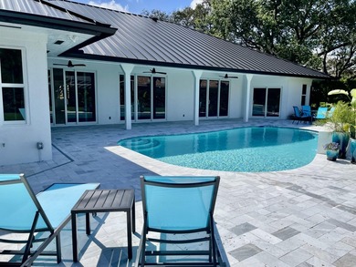 Welcome to this reimagined 4-bedroom, 3-bathroom, pool home in - photo 39