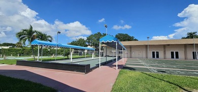 Beautiful BAHAMAS STYLE, 1BD/1.5BA ground-floor condo in a - photo 21