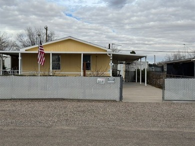 Look no further! This well-maintained manufactured home sits on