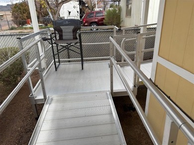 Look no further! This well-maintained manufactured home sits on