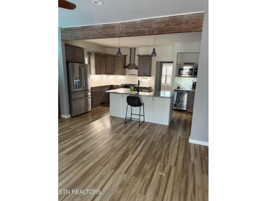This Beautiful home, nestled on a wooded 5.4 acre lot is like - photo 4