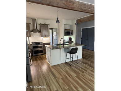 This Beautiful home, nestled on a wooded 5.4 acre lot is like - photo 5