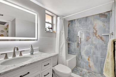 A brand-new bathroom, consistent flooring & water view - photo 1