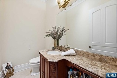 MAJESTICALLY SET ON 2 MANICURED ACRES, THIS BRICK COLONIAL MANOR - photo 19