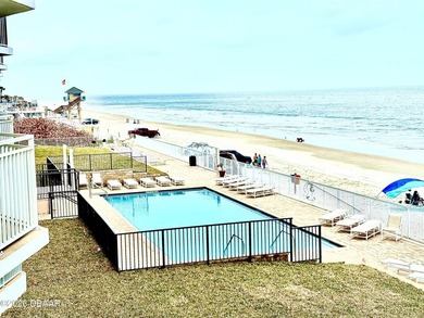 Experience breathtaking direct oceanfront living in this