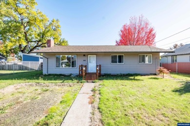 This property hosts both a main home &amp; a studio with alley