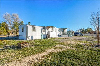 Affordable living just outside of Las Vegas! This 2 bedroom, 1