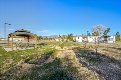 Affordable living just outside of Las Vegas! This 2 bedroom, 1