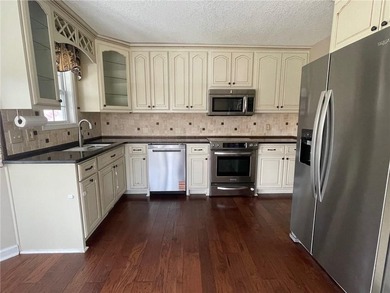 Welcome to your country DREAM home escape on 1.17 Acres!! This