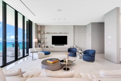 Experience oceanfront luxury living at its finest in this