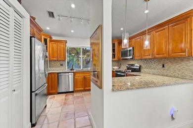 Behind the gates of Boca Pointe, this 3BR/3BA corner townhome - photo 16