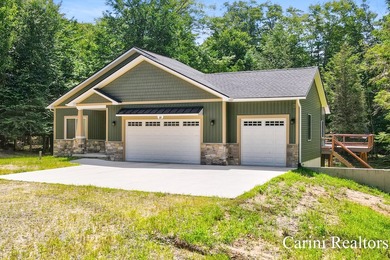 Nestled on a private wooded lot within a gated community, this - photo 3