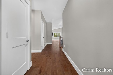 Nestled on a private wooded lot within a gated community, this - photo 8