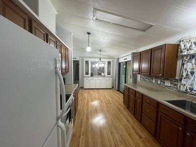 Extremely well maintained Palm Harbor Home with popular split - photo 11
