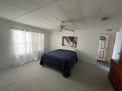 Extremely well maintained Palm Harbor Home with popular split - photo 19